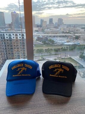 Shellback Tavern Trucker Hat - Blue or Black with Yellow Logo